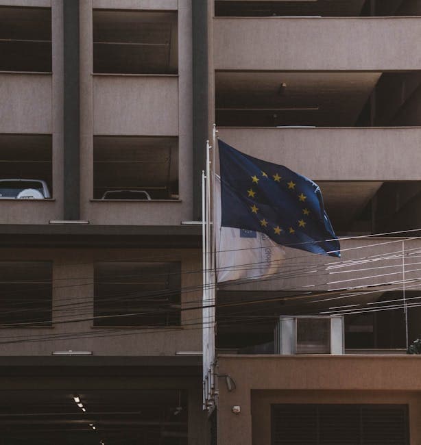 European Union flag flutters on a building facade in Nairobi, Kenya.